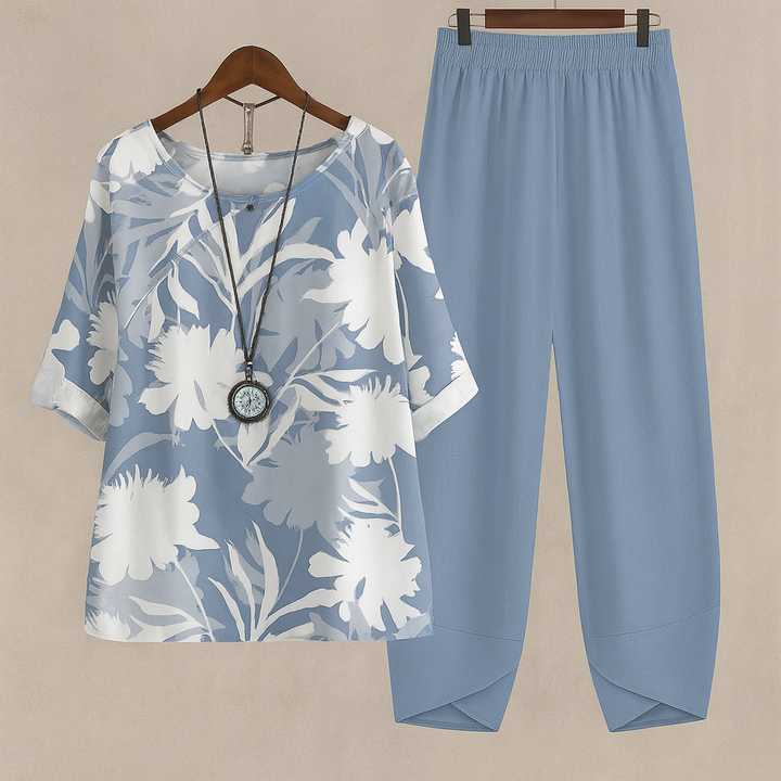 Vibrant floral two-piece set for women, featuring a stylish blouse and flowy pants, ideal for spring/summer.