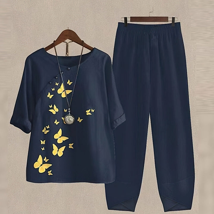 Comfortable women's plus size floral blouse and matching pants set, a relaxed fit for summer vacations.