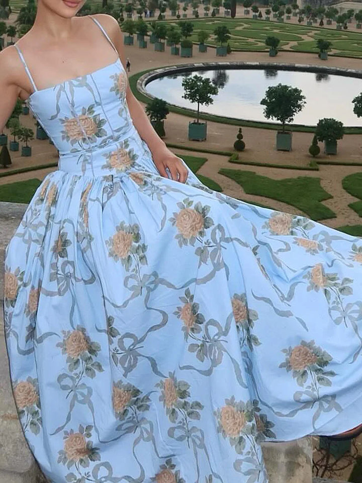 Strappy floral print midi dress for women, featuring a corset bodice. Ideal for prom or evening wear.