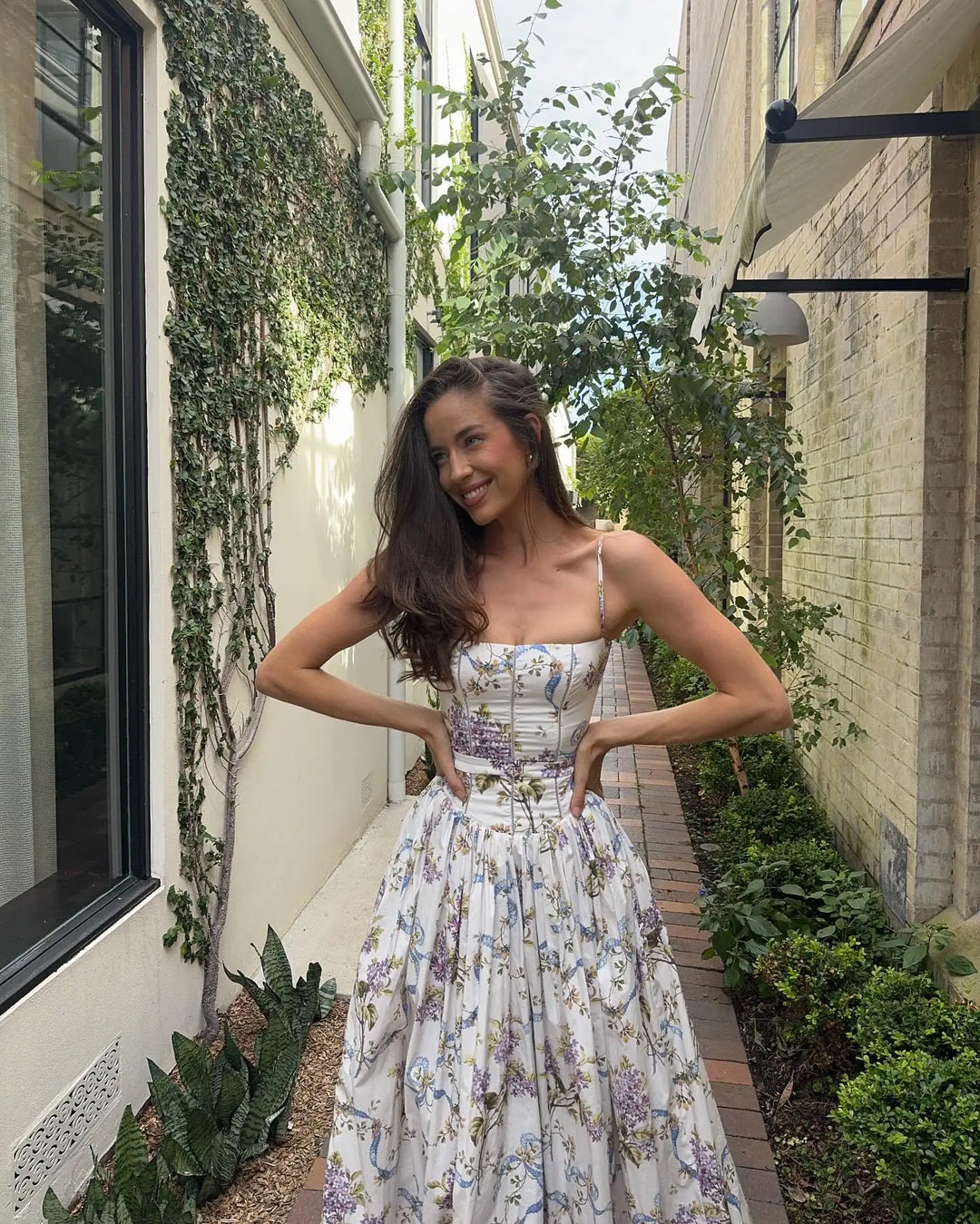 Women's formal evening wear: a gorgeous floral print corset midi dress, perfect for elegant events.