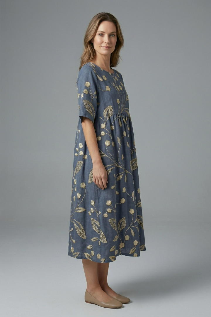 Modern women's floral midi dress with a flattering flared skirt, round neck & short sleeves. Spring/summer essential.