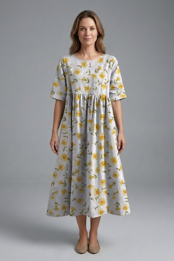 Effortless style in a women's floral print midi dress. Elegant round neck, short sleeves & comfortable fit.