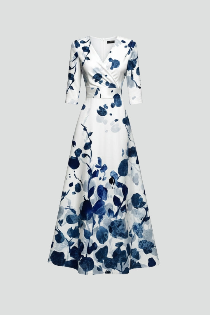 Women's elegant floral print V-neck maxi dress with a flowing flared skirt, perfect for summer.