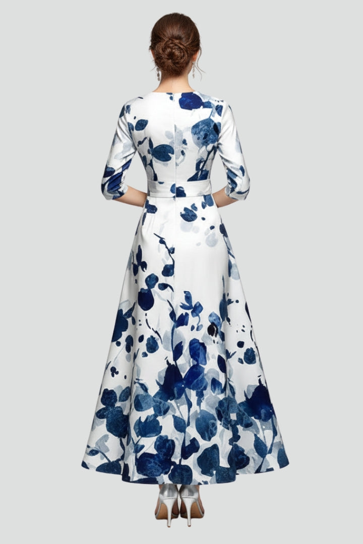 Beautiful women's floral V-neck maxi dress, detailed with midi sleeves and a gracefully flared skirt.