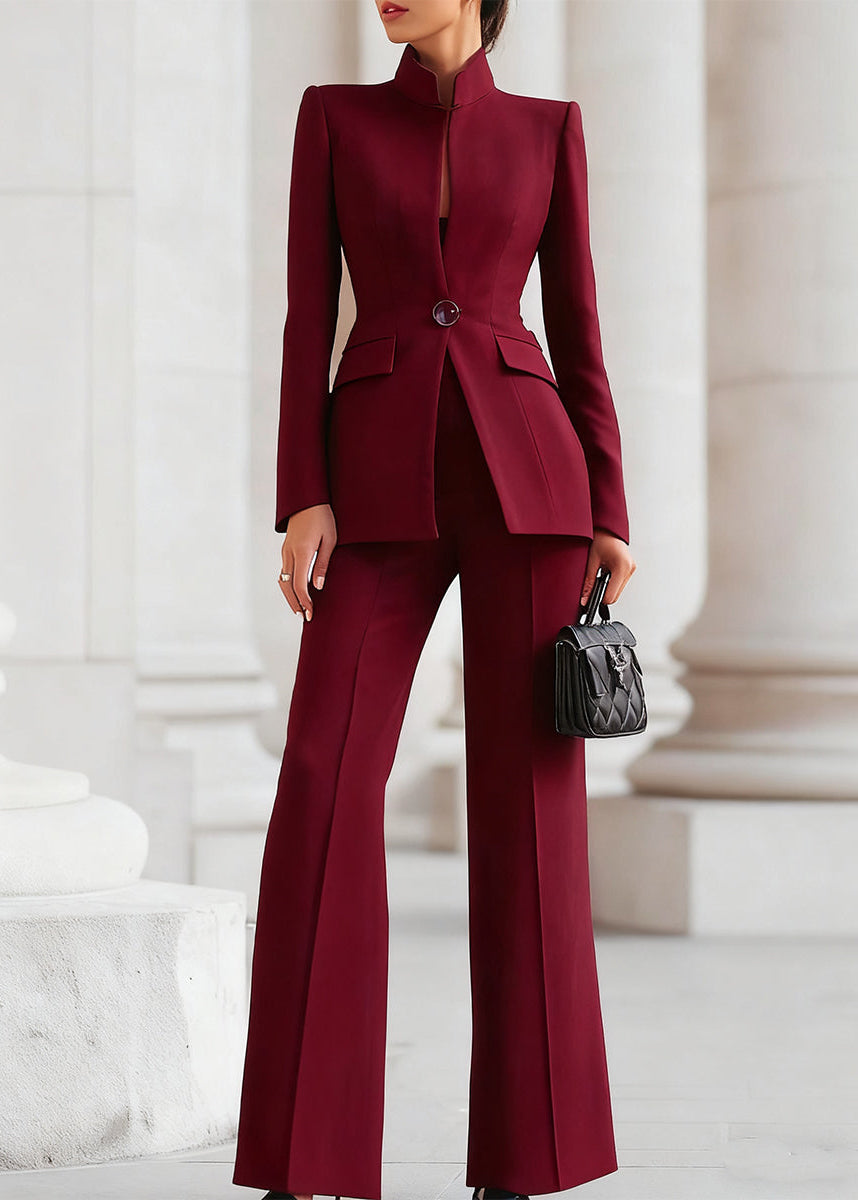 Formal women's trouser suit with high-collar blazer and wide-leg pants for power dressing.
