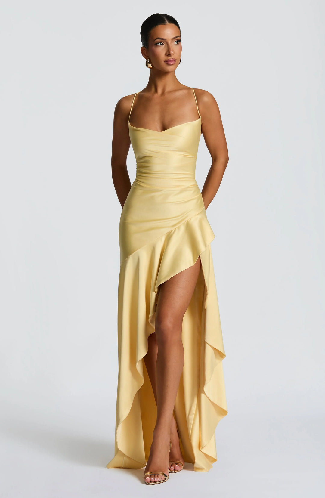 Women's formal evening gown, sleeveless, with a graceful high slit and a flattering draped neckline.