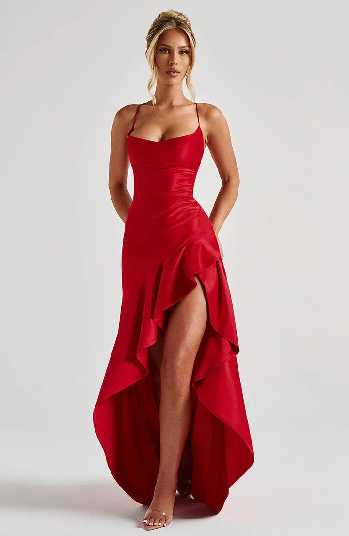 Chic women's long wedding guest dress with a high slit, open back, and elegant floor-length silhouette.