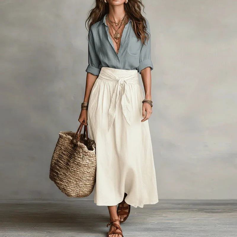 Women's elegant linen co-ord set with short-sleeve blouse and midi skirt, perfect for summer casual wear.