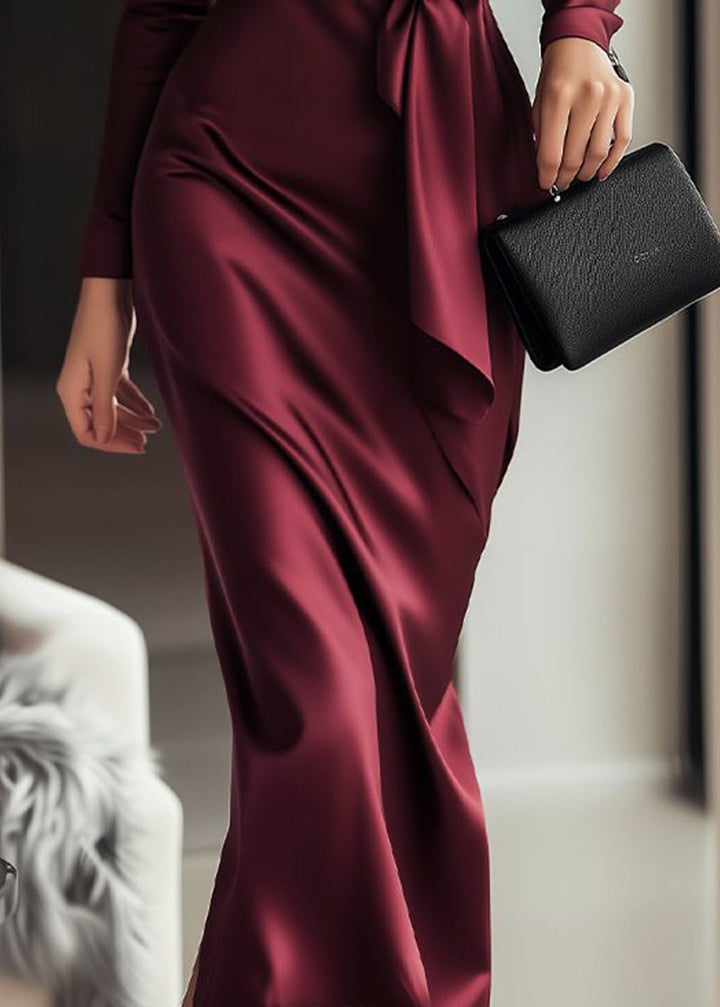 Elegant women's long sleeve wrap gala dress with a flattering tie waist and V-neck. Sophisticated formal wear choice.