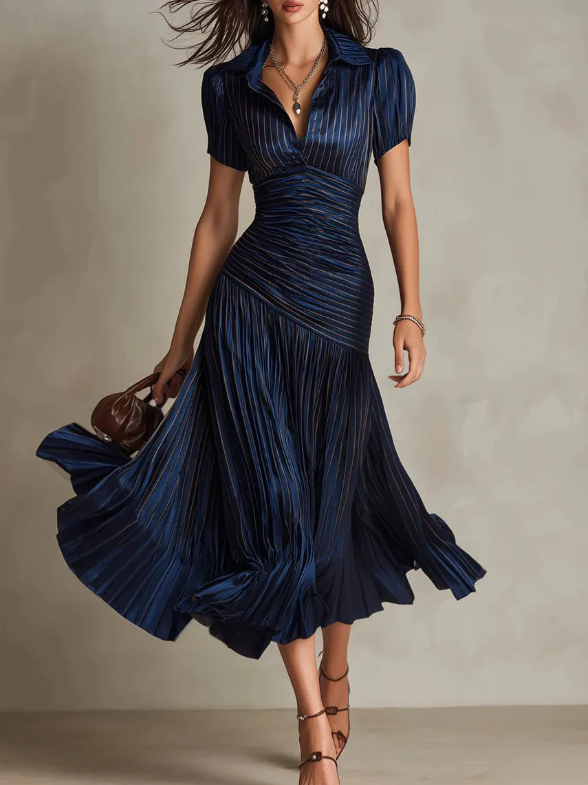 Women's elegant pleated A-line midi dress with collar. Sophisticated style for day to night wear.