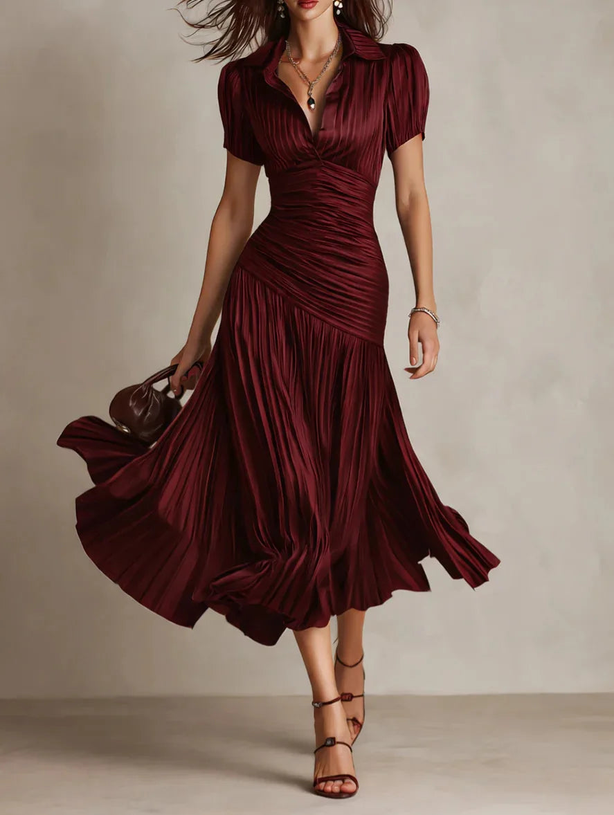 Graceful movement in this women's elegant pleated midi dress. A-line shape, perfect for any occasion.