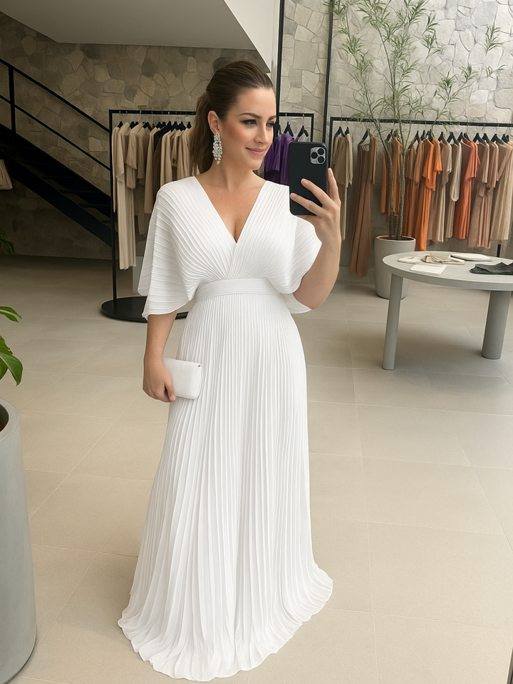 Comfortable & stylish pleated maxi dress with batwing sleeves, perfect for a wedding guest or formal party.