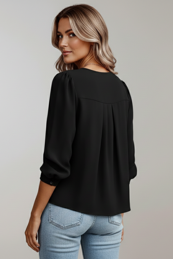 Professional yet casual women's puff sleeve blouse, an elegant round neck top for work or leisure.
