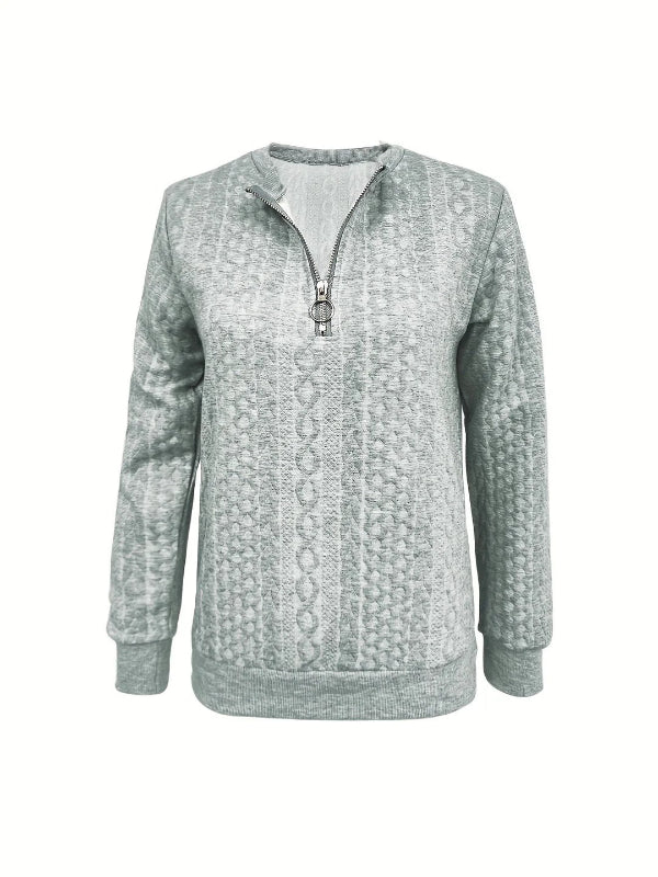 Casual yet elegant women's spring pullover top with a half-zip neckline, versatile for everyday wear.