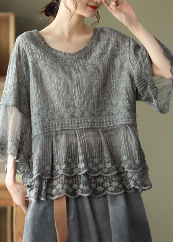 Elegant women's embroidered blouse, relaxed fit, with a beautiful tiered lace hem and practical half sleeves for any occasion.
