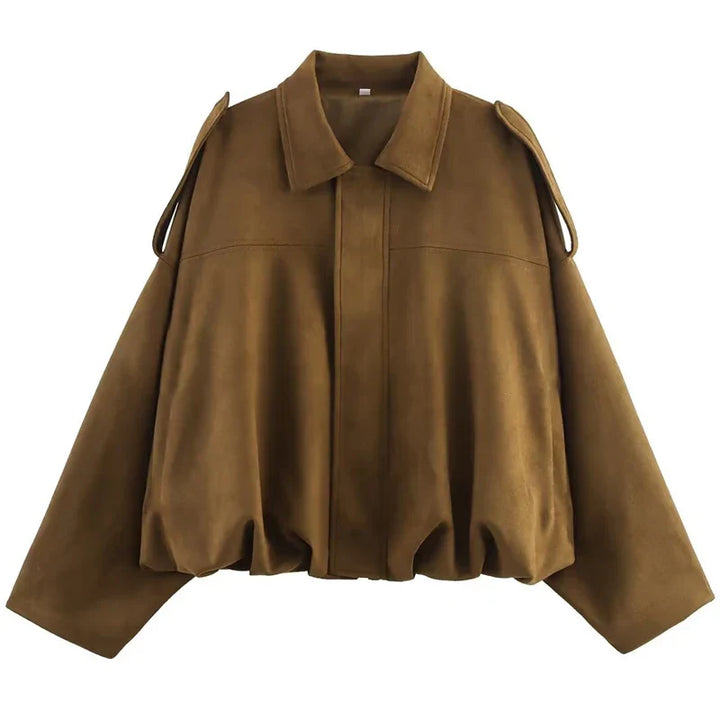 Close-up of the textured faux suede material on a women's bomber jacket, suitable for spring