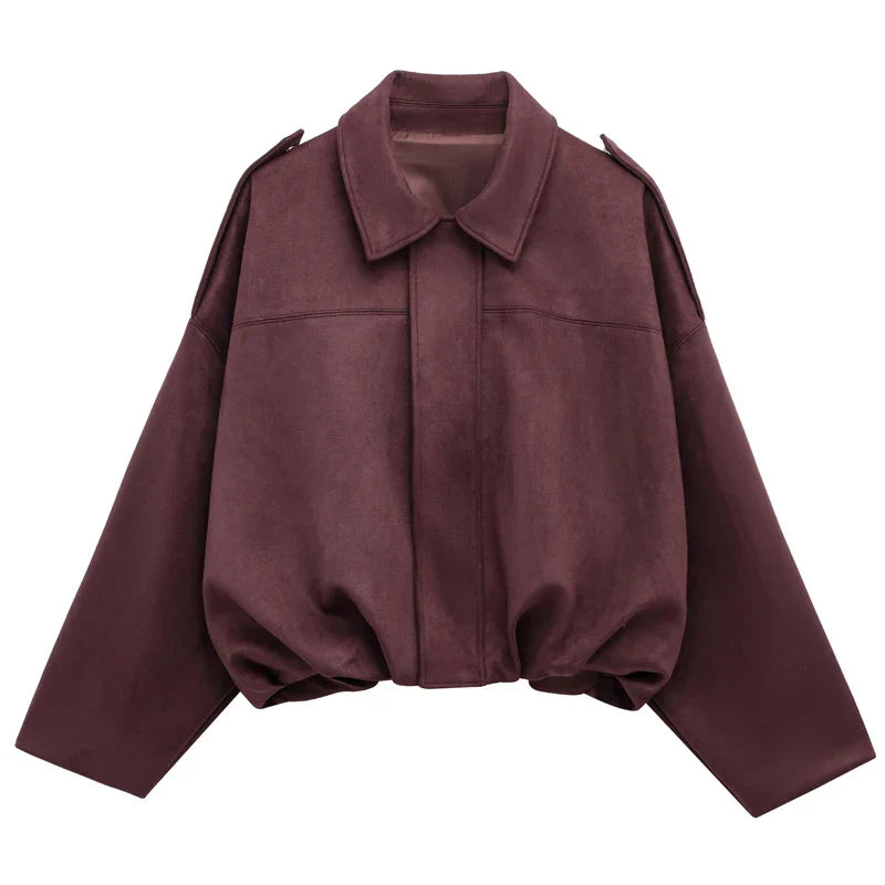 Back view of women's short faux suede bomber jacket, showcasing the clean design, fall outerwear