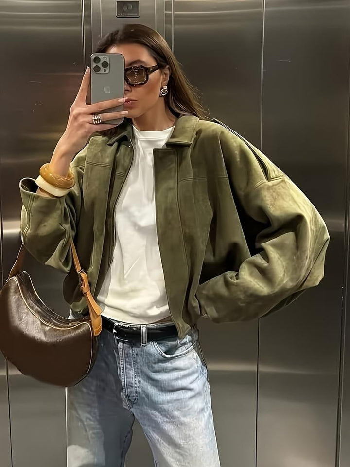 Full view of a women's faux suede jacket with a functional zip-front, emphasizing its fashion outerwear appeal