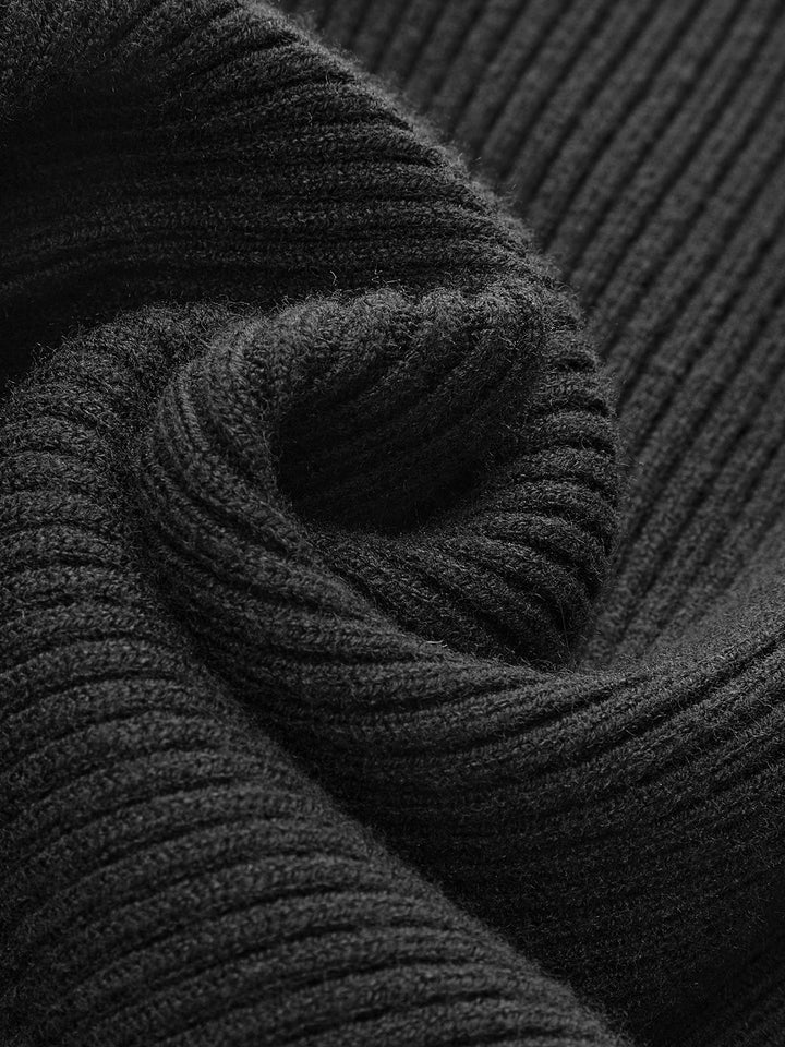 Full-body shot of a woman in a fitted ribbed knit turtleneck sweater, a trendy spring fashion essential.