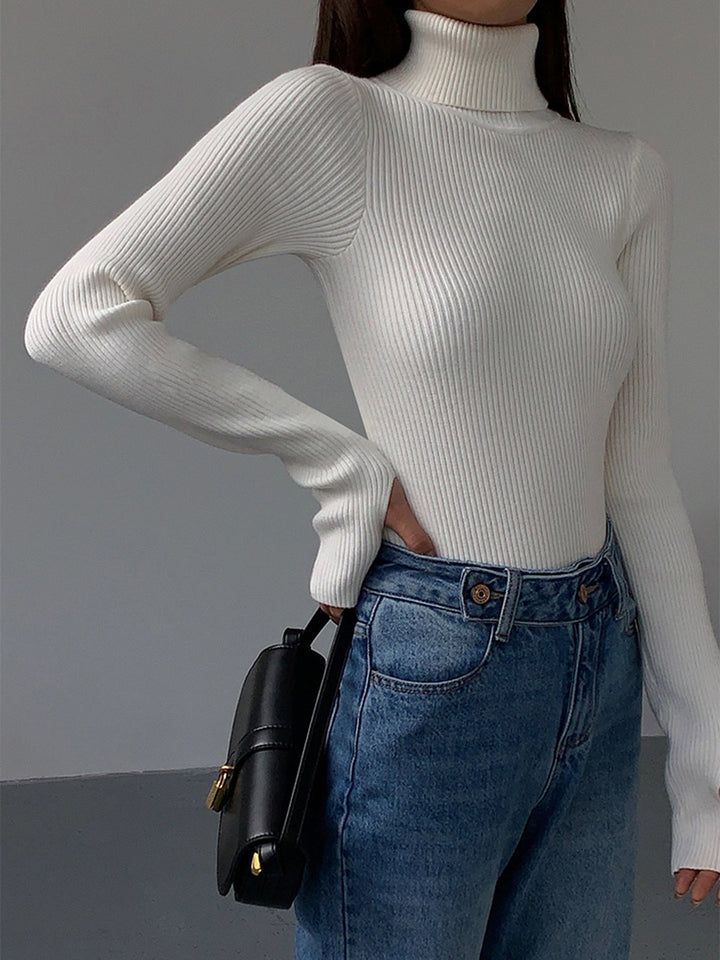 White ribbed knit turtleneck top for women, a timeless and elegant piece for any spring casual collection.