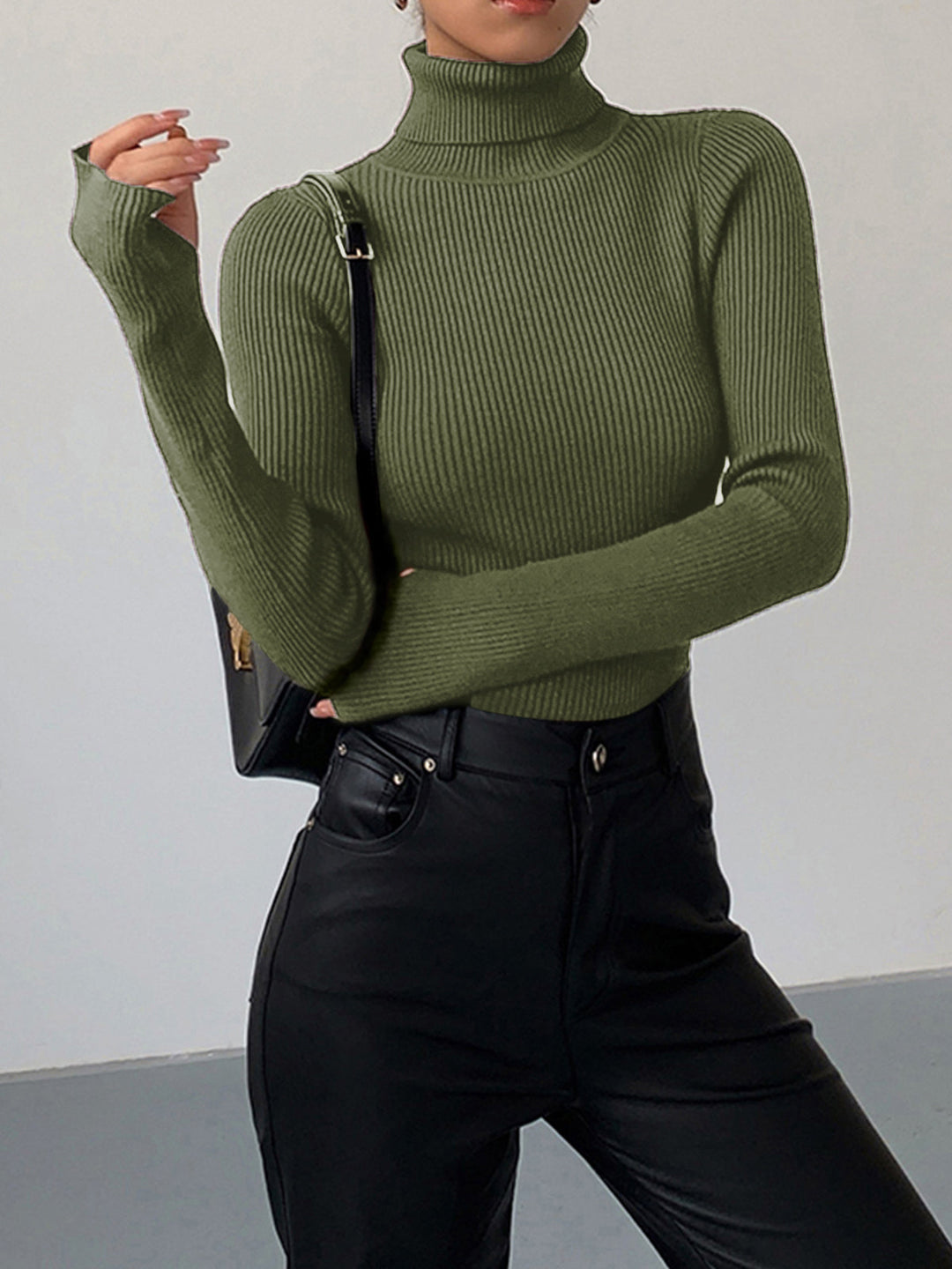 Assortment of women's ribbed knit turtleneck sweaters in various colors, showcasing ultimate spring versatility.