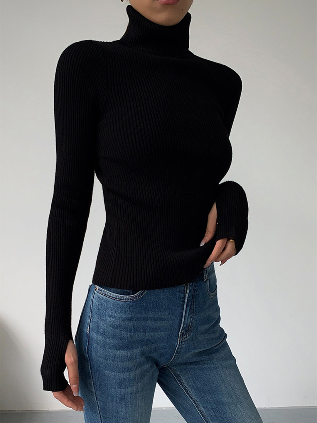 Fashionable women's ribbed knit turtleneck top in a vibrant color, perfect for adding a pop to spring outfits.