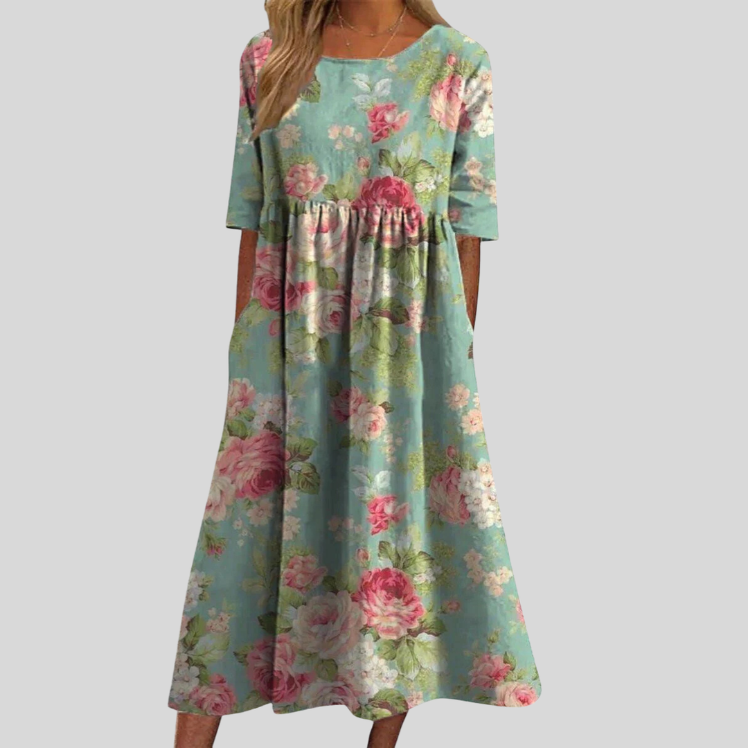 Elegant women's floral midi dress, empire waist, three-quarter sleeves, pockets. Perfect for spring/summer.