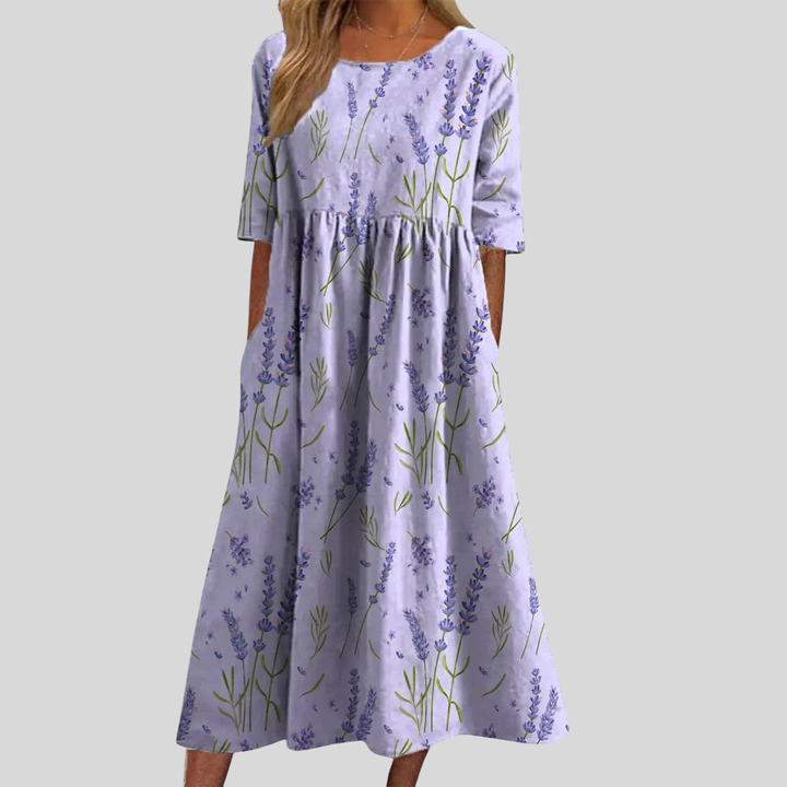 Casual women's floral midi dress with empire waist and pockets. Ideal for spring, summer day wear.