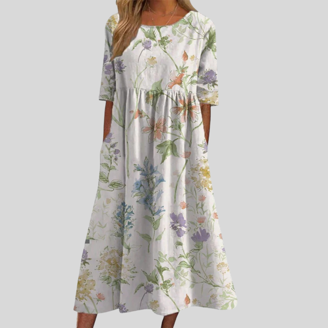 Romantic floral print midi dress for women, flattering empire waist, flowy three-quarter sleeves & pockets.