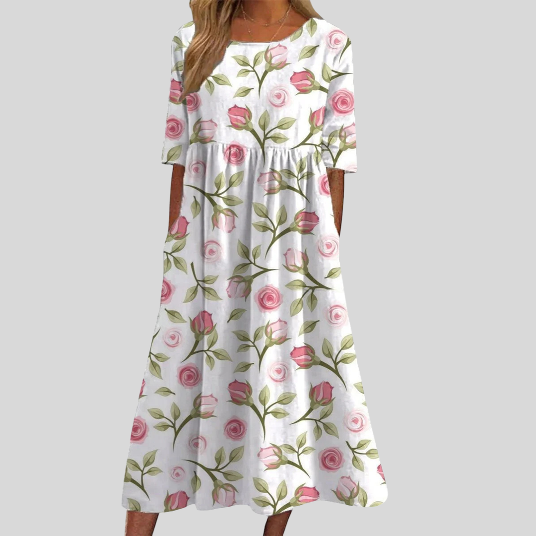 Chic women's floral print midi dress with an empire waist, three-quarter sleeves, and essential pockets.