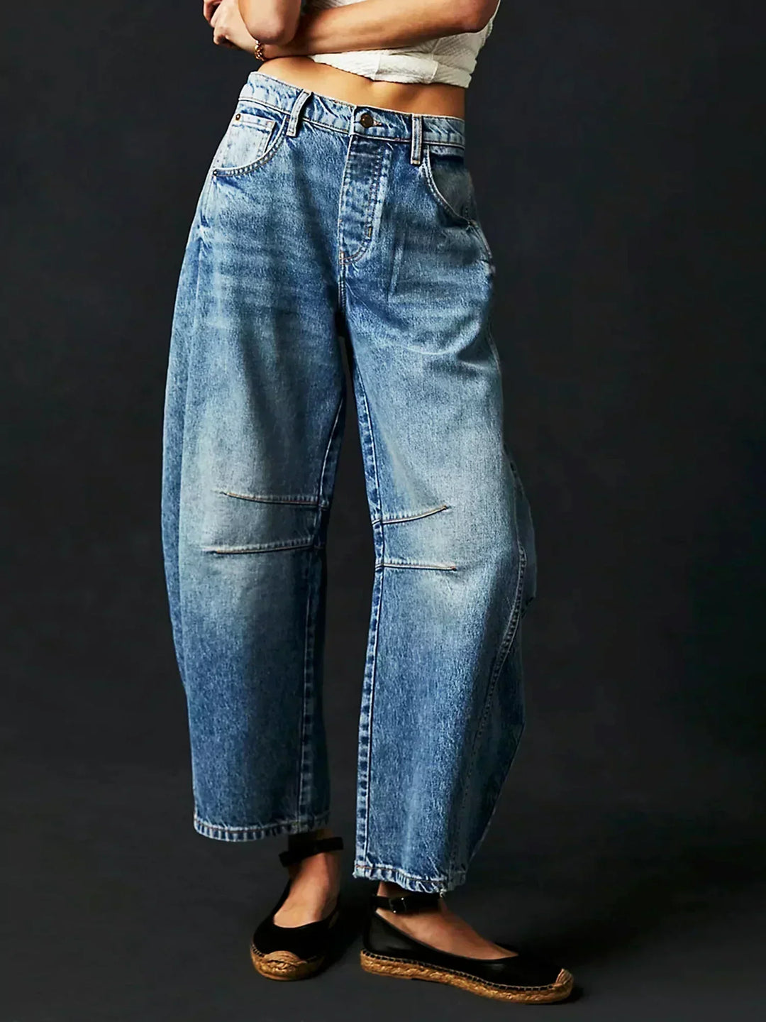 Stylish women's high-waisted denim jeans, wide leg design for everyday fashion.