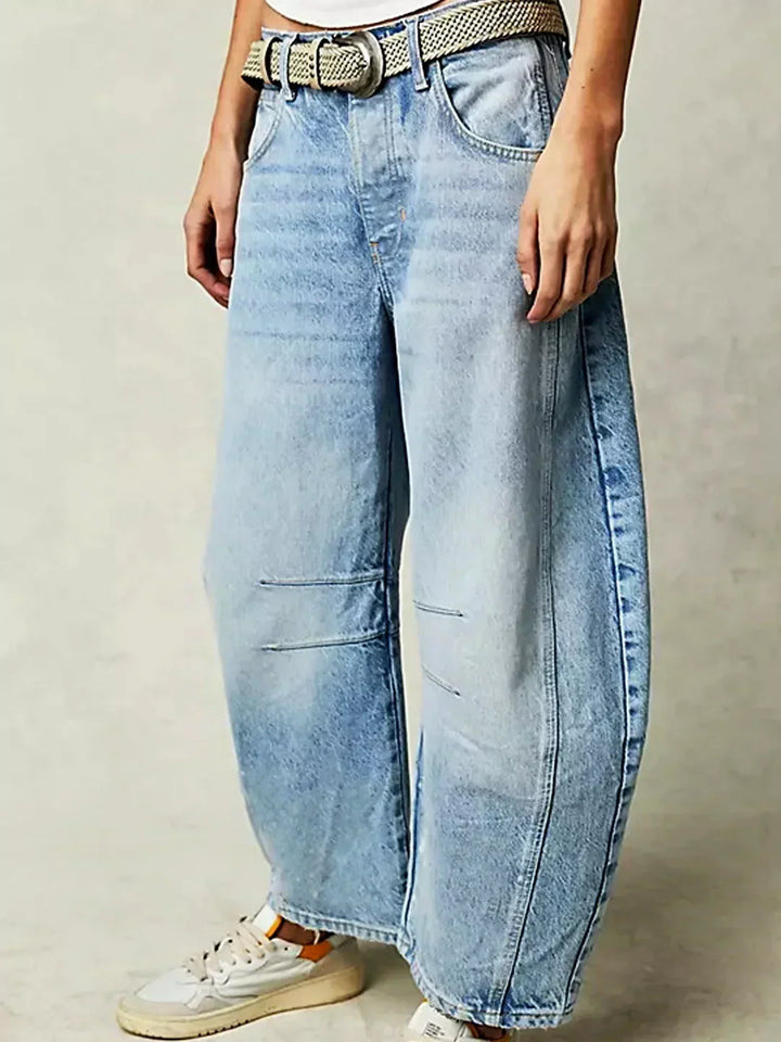 Relaxed fit women's high-waisted wide-leg jeans in denim, a stylish fashion staple.