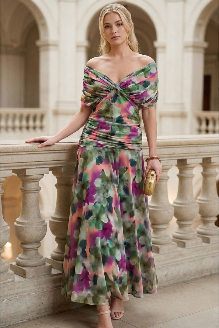 Women's off-shoulder floral maxi dress featuring elegant ruching, sweetheart neckline, ideal for events.