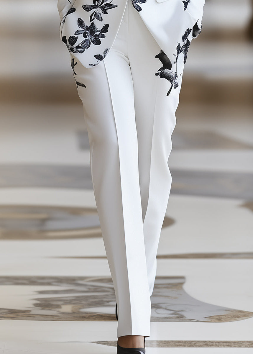 Chic women's floral pant suit set. Tailored blazer and formal pants, great for business casual or spring fashion.