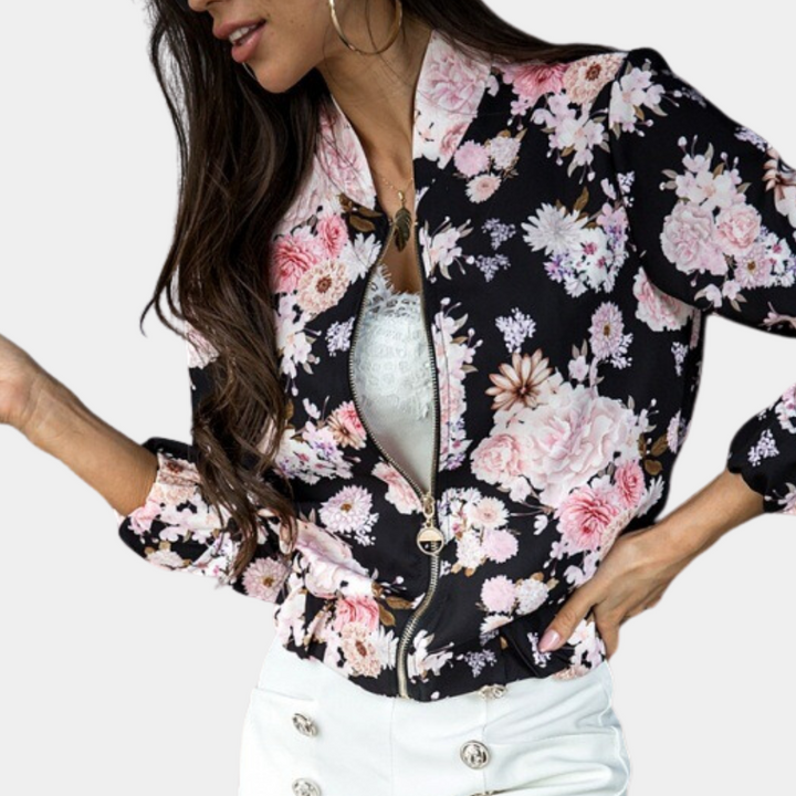 Casual women's bomber jacket with vibrant floral print, full zip-up closure. Ideal outerwear for spring fashion.