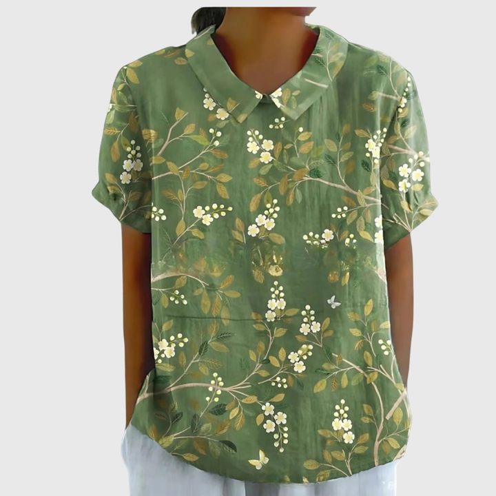 Women's floral print collared short sleeve blouse. Relaxed fit, versatile for summer and office.