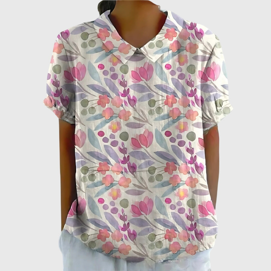 Women's short sleeve collared blouse with a beautiful floral print. Relaxed fit, versatile top.