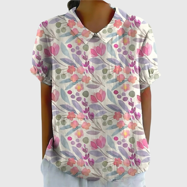 Women's short sleeve collared blouse with a beautiful floral print. Relaxed fit, versatile top.