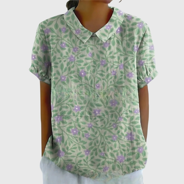 Casual elegant floral print women's blouse. Relaxed fit, short sleeve, collared for everyday style.
