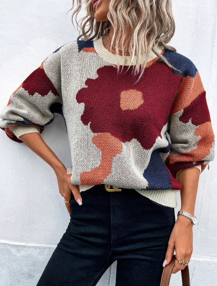 Comfortable women's long sleeve pullover sweater with a vibrant floral print, ideal for winter.