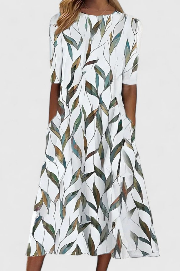 Stylish women's floral print midi dress featuring a comfortable round neck, short sleeves, and practical pockets for summer.