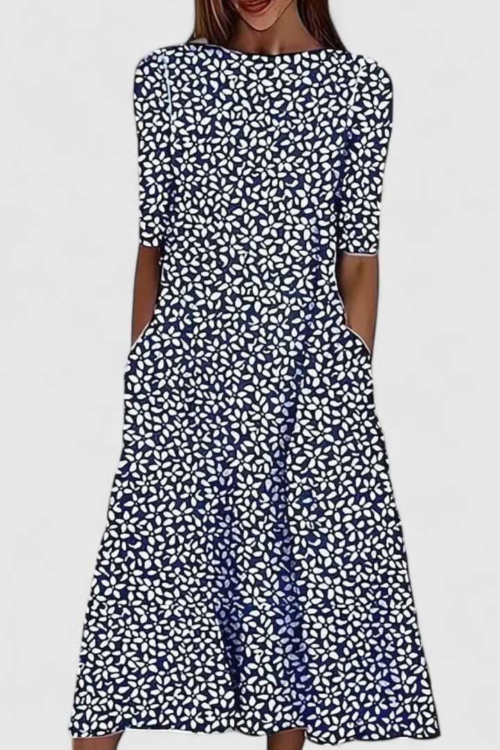Casual women's floral midi dress with short sleeves, round neck, and handy pockets. Ideal summer printed dress.
