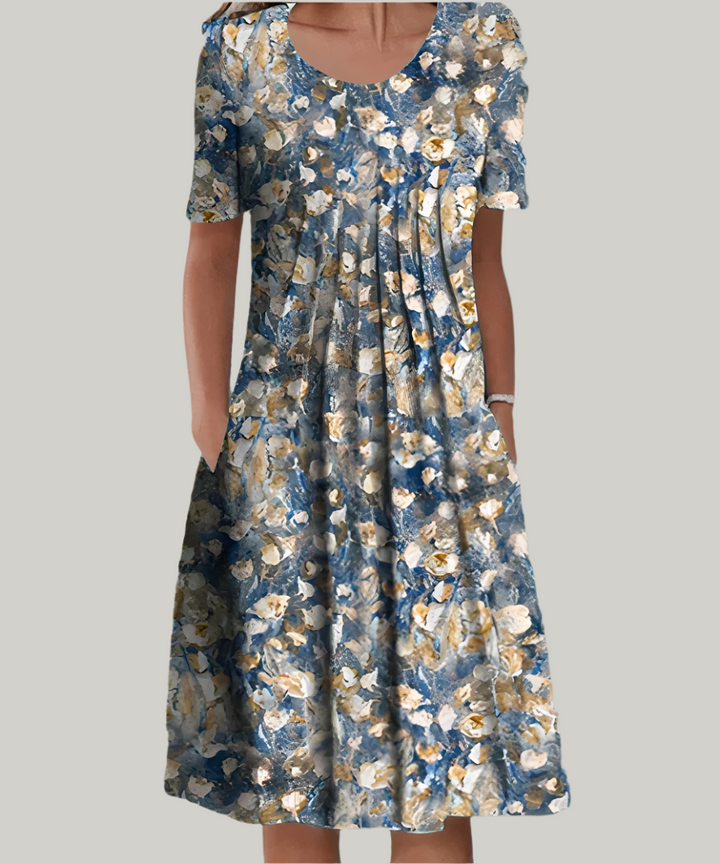 Elegant floral print midi dress for women, with short sleeves & pockets. A versatile casual or everyday summer fashion piece.