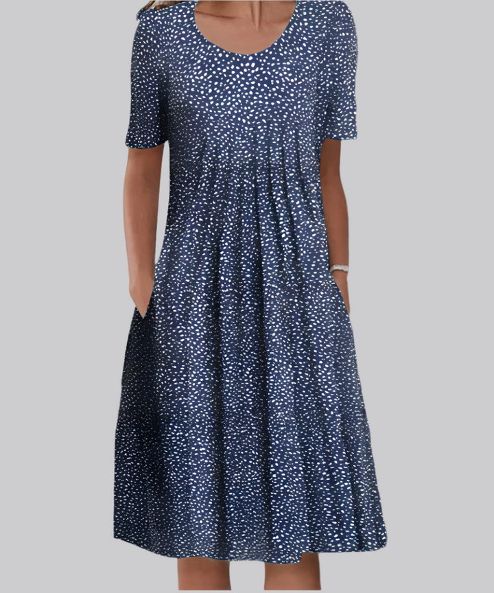 Plus size women's floral midi dress with short sleeves & pockets, offering comfortable and stylish summer fashion.