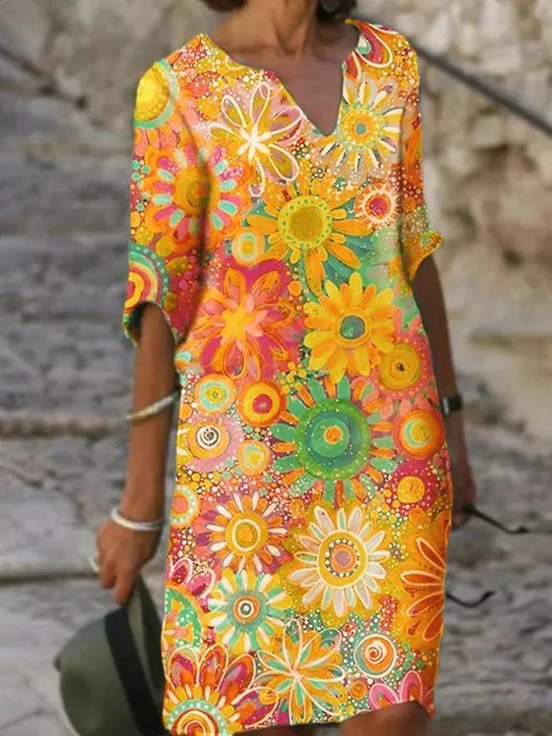 Women's floral print V-neck A-line summer dress, knee-length, perfect for casual or vacation wear.
