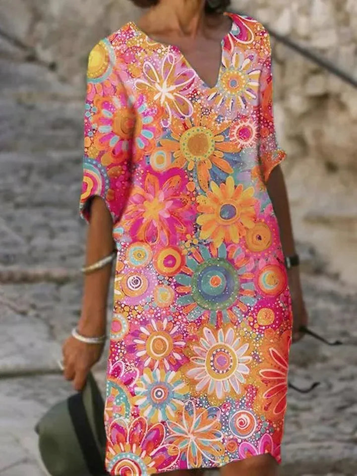 Comfortable women's floral print V-neck summer dress, knee-length A-line cut for casual everyday fashion.