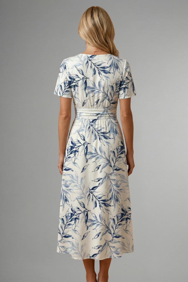 Flared A-line women's floral V-neck midi dress, short sleeves, offering effortless charm for summer.