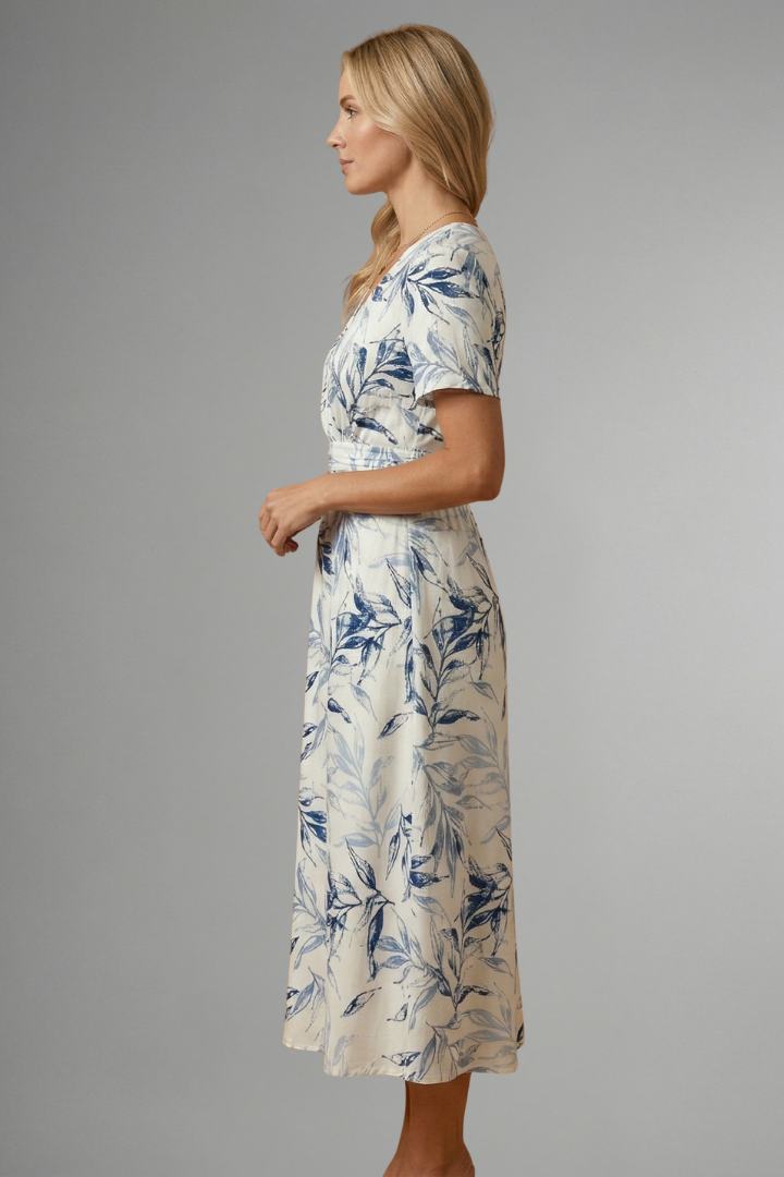 Charming women's floral V-neck A-line midi dress with short sleeves, perfect for spring/summer days.