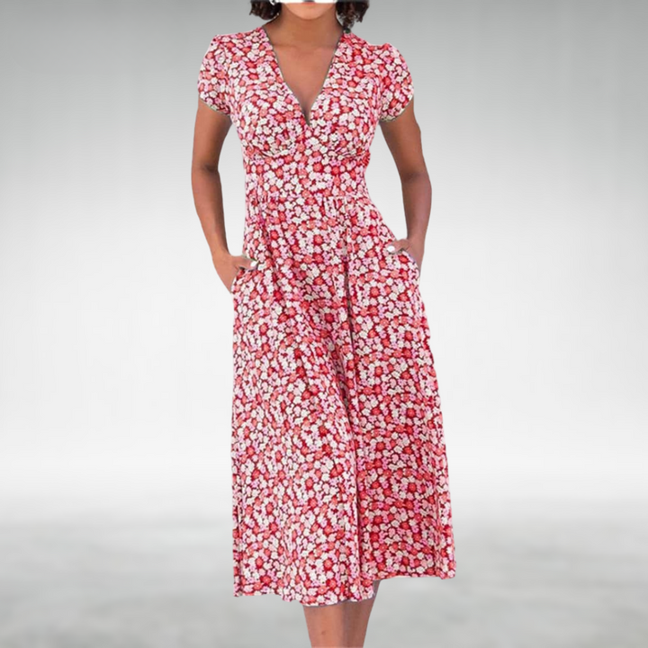 Comfortable women's midi dress featuring a vibrant floral print and practical pockets.
