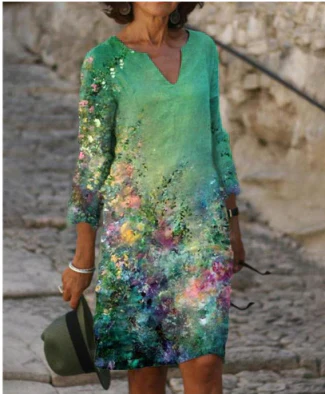 Summer women's dress: a V-neck midi with an eye-catching floral pattern. Flowy and elegant.